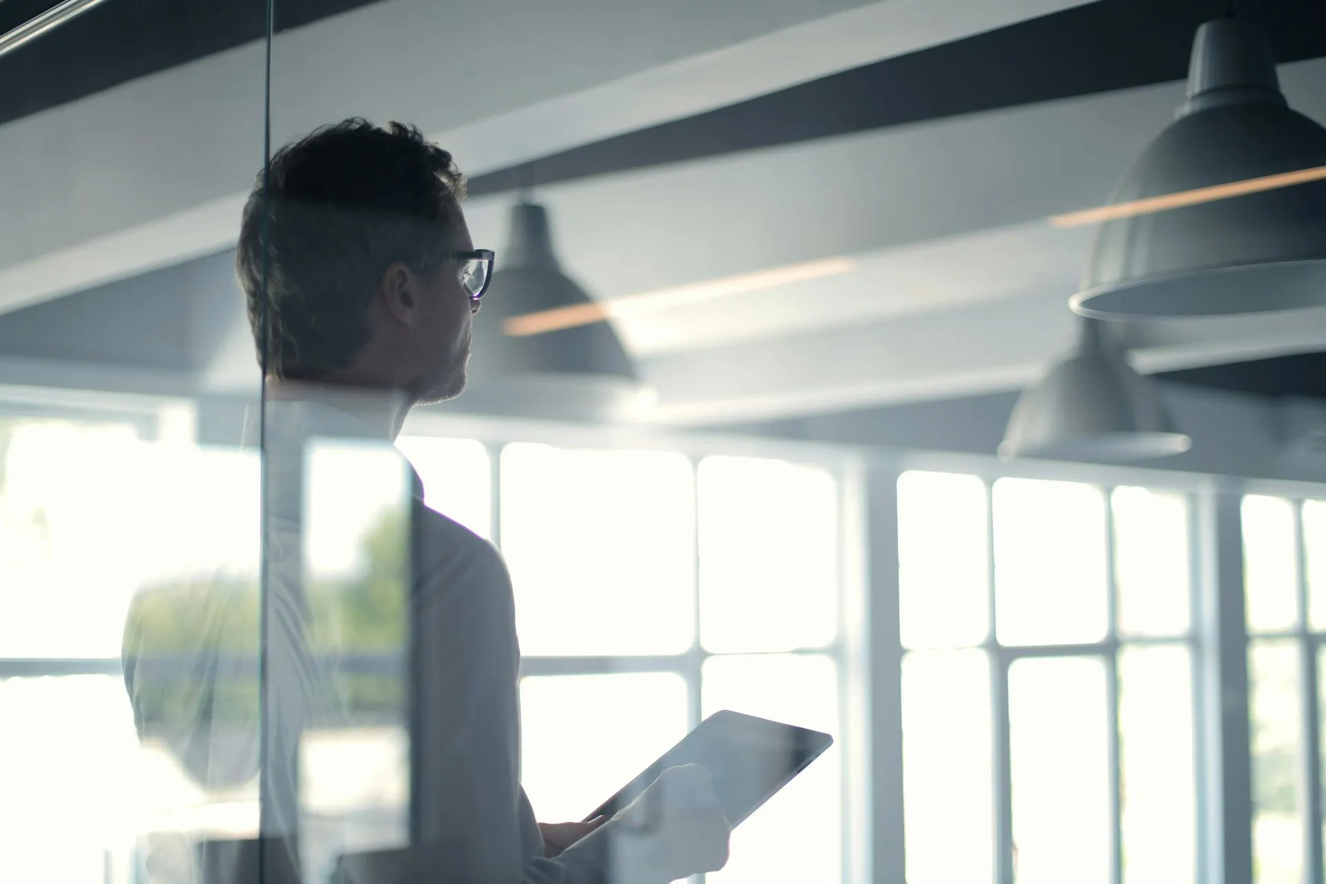 Leader reaching across a desk to build a professional connection